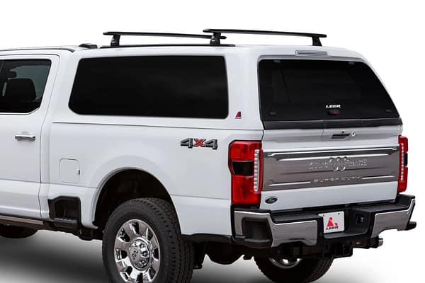 LEER 100XQ White Ford truck with LEER 100XQ camper shell and custom truck bed accessories in Miami FL