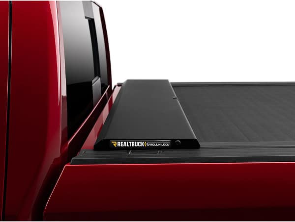 305d4c5e47efe6eb406cbb9c040b7268 Roll-N-Lock retractable truck bed cover installed on a custom truck at Accessory World Customs in Miami