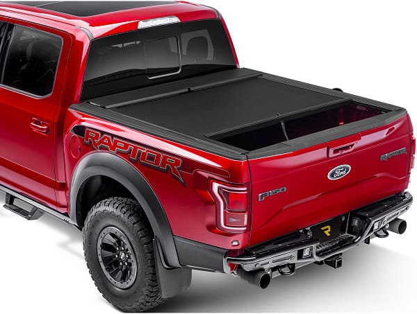 52a38d47bf09789fd37d4ec08170202c Roll-N-Lock retractable truck bed cover installed on a custom truck at Accessory World Customs in Miami
