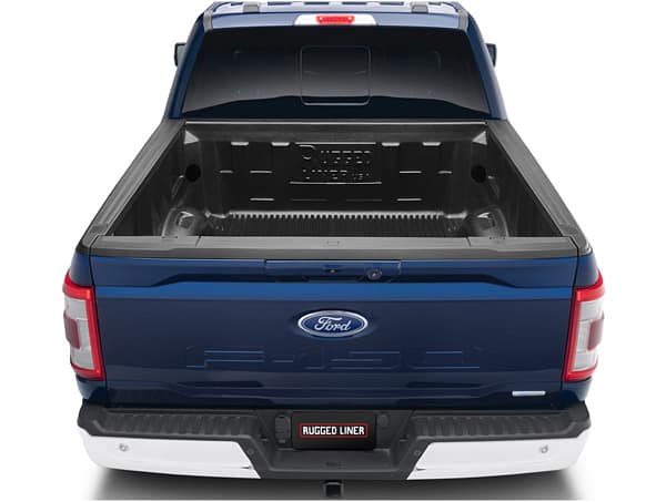 7153a76adced3b56e65cac569cb87161 Rugged Liner custom-molded truck bed liner installed on a pickup truck at Accessory World Customs in Miami