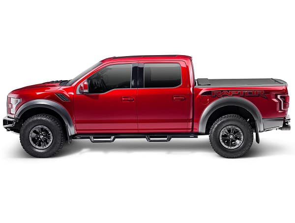 e57bf6459c050ea406a08de334b35612 Roll-N-Lock retractable truck bed cover installed on a custom truck at Accessory World Customs in Miami