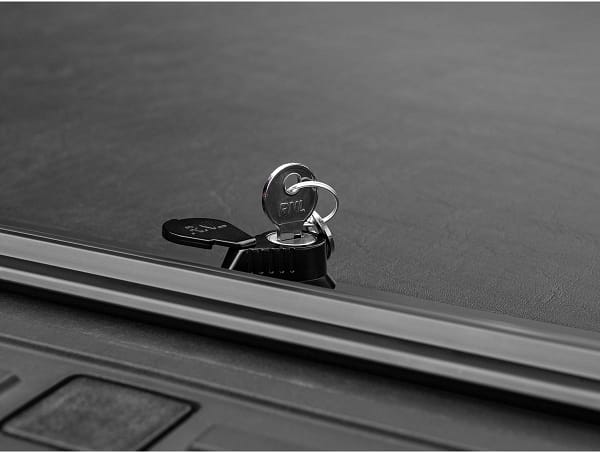 e7017d7756f58144321bb2f5c54fc475 Roll-N-Lock retractable truck bed cover installed on a custom truck at Accessory World Customs in Miami